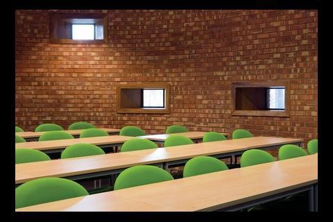 Inside the lecture theatre, the brick wall is expressed in cheap Flettons rather than deluxe handmade bricks